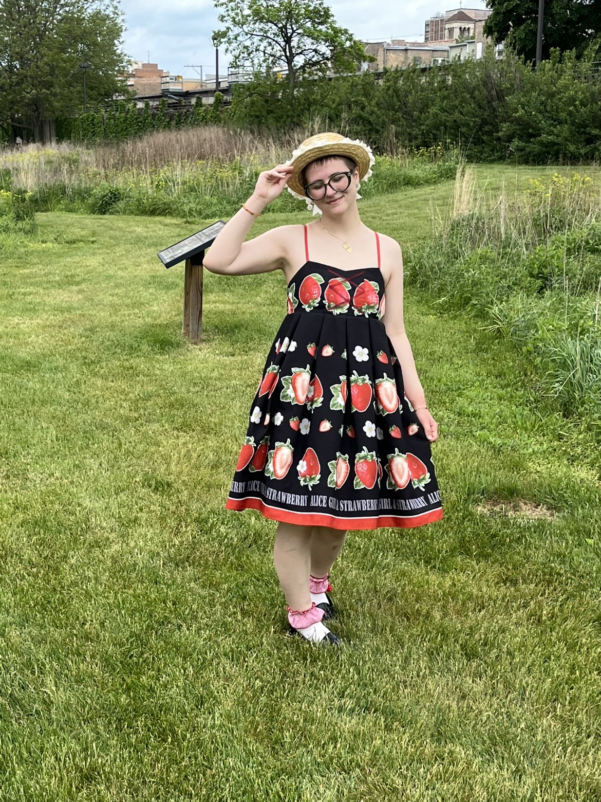 charlotte in a black dress with strawberries on it